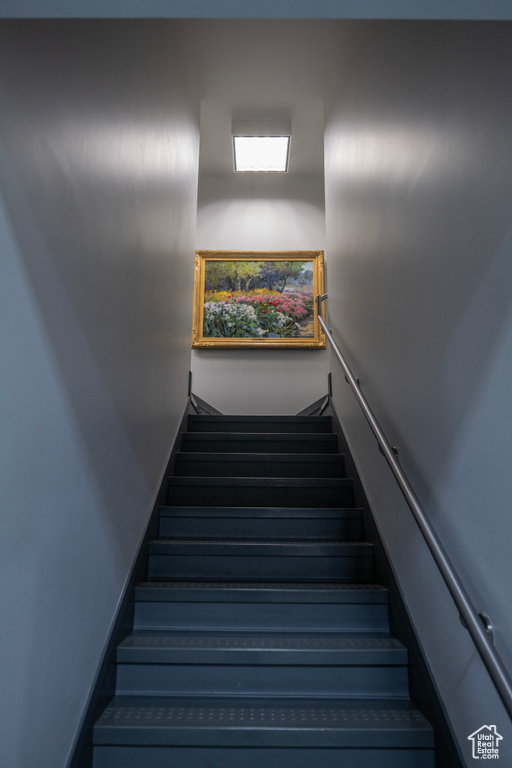 Stairway featuring baseboards