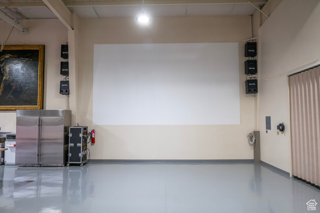 Garage featuring baseboards