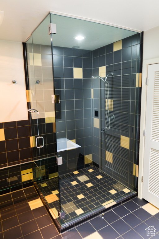 Full bath featuring tile patterned floors and a stall shower
