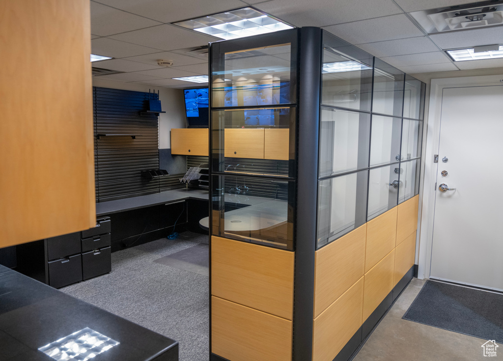 Kitchen featuring a drop ceiling and an office area