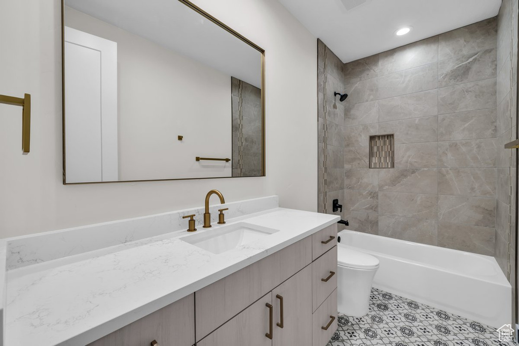 Full bath featuring vanity, tub / shower combination, and recessed lighting