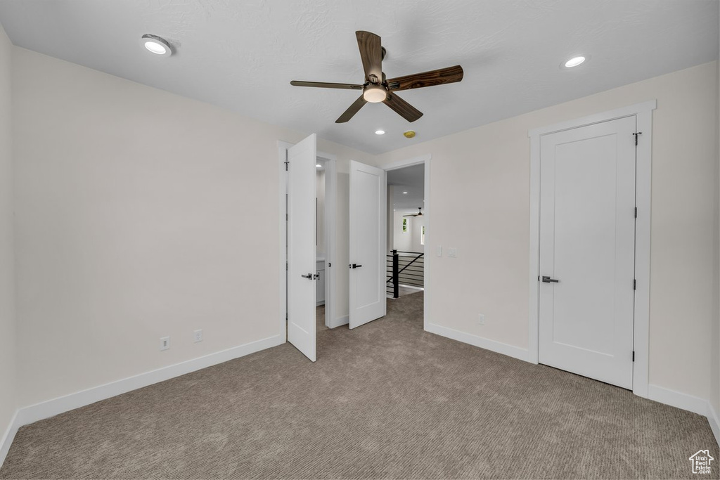 Unfurnished bedroom with carpet, recessed lighting, and a ceiling fan