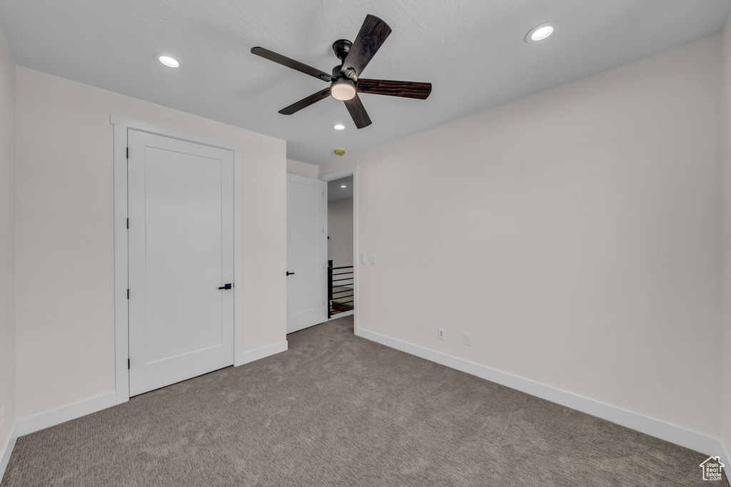 Unfurnished bedroom featuring carpet flooring, recessed lighting, and ceiling fan