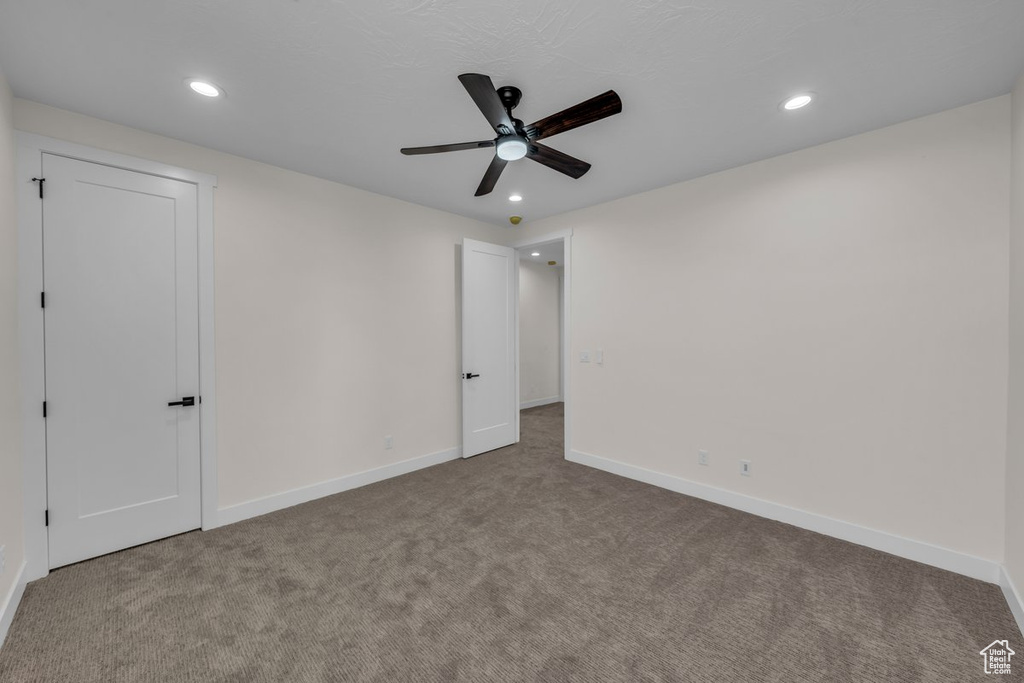 Unfurnished bedroom featuring carpet floors, recessed lighting, and a ceiling fan