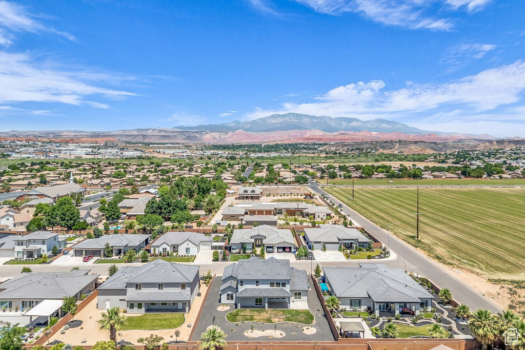 Aerial perspective of suburban area with a mountain backdrop