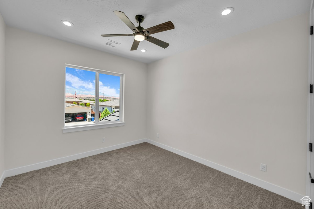 Unfurnished room with ceiling fan, recessed lighting, and carpet flooring