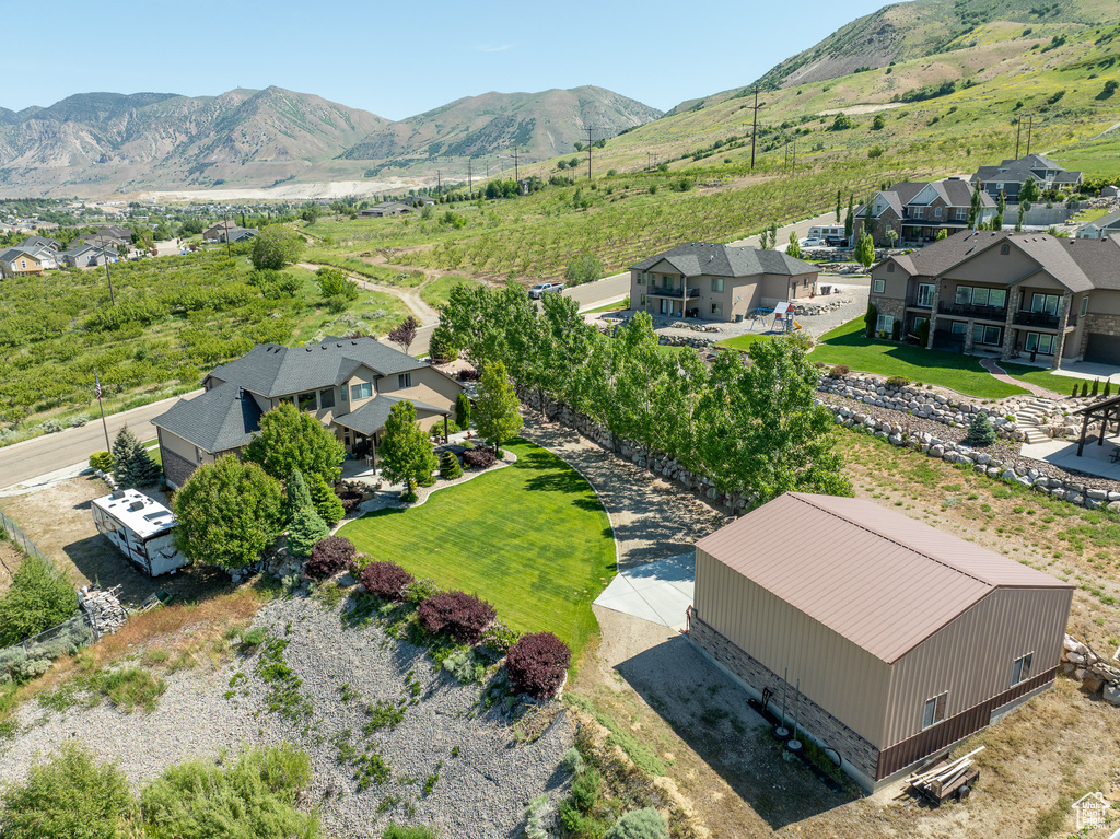 Aerial view of residential area featuring a mountain backdrop