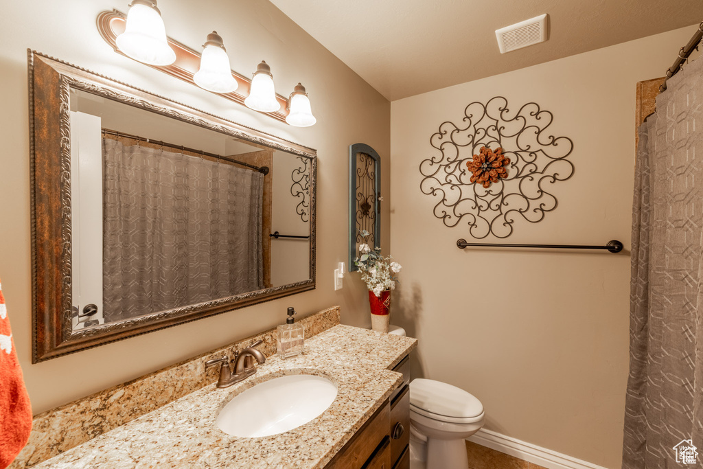 Bathroom with vanity and toilet