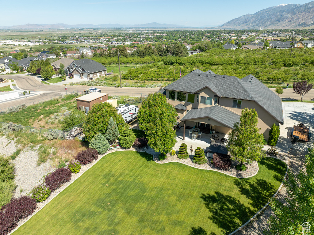 Aerial view of residential area featuring a mountain backdrop