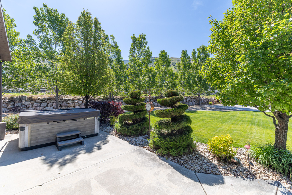 View of patio / terrace featuring a hot tub