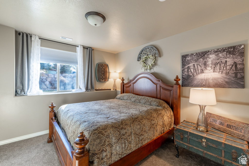 Bedroom with carpet and baseboards