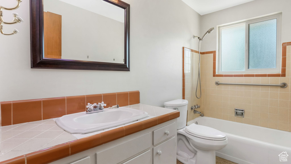 Full bath with vanity and shower / tub combination