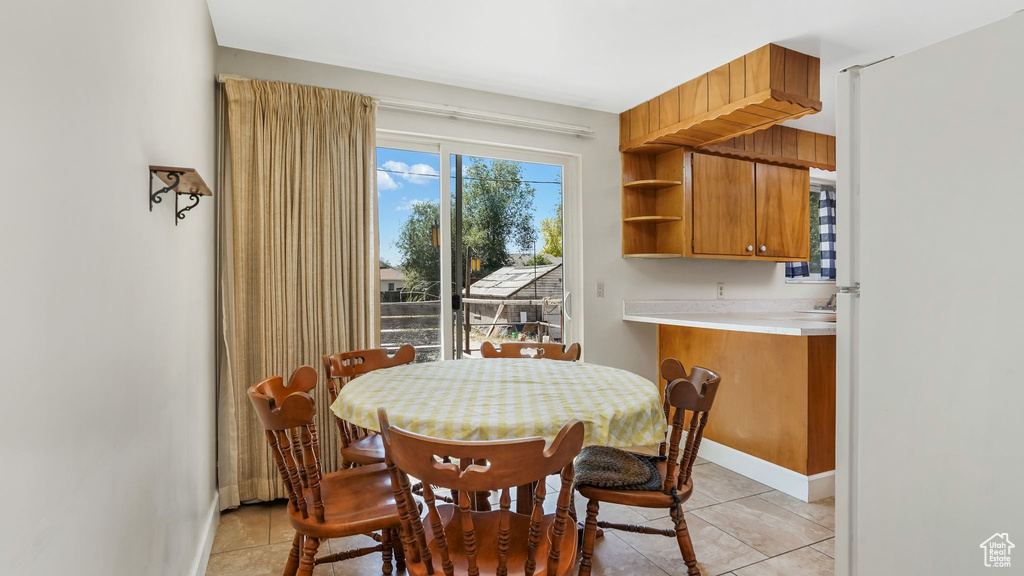 Dining room featuring light tile patterned flooring