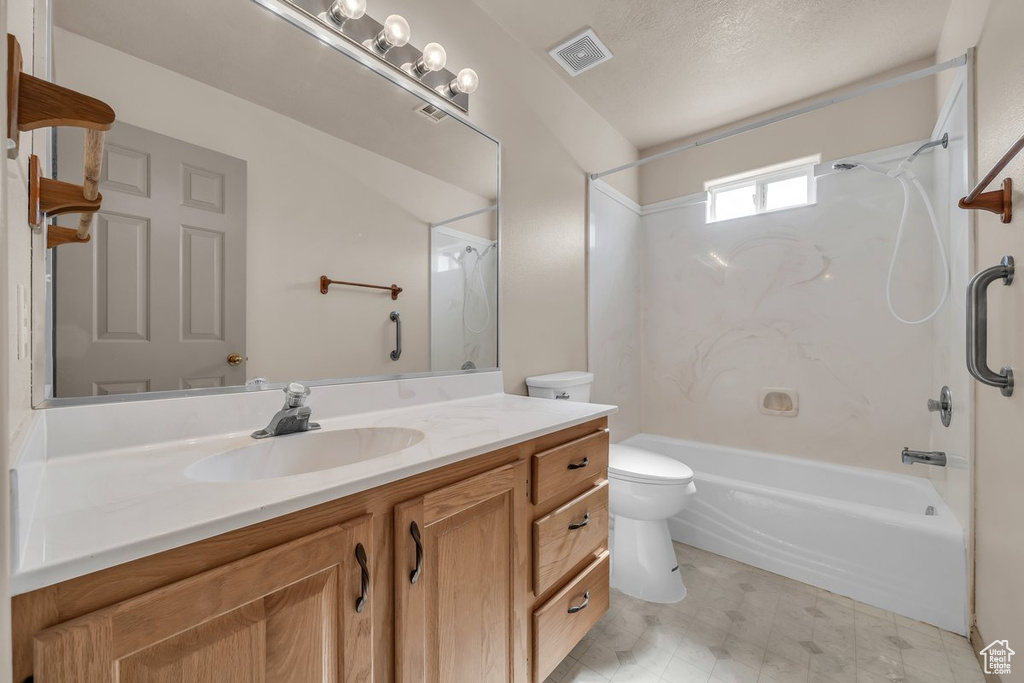 Full bath featuring bathing tub / shower combination, vanity, and tile patterned floors