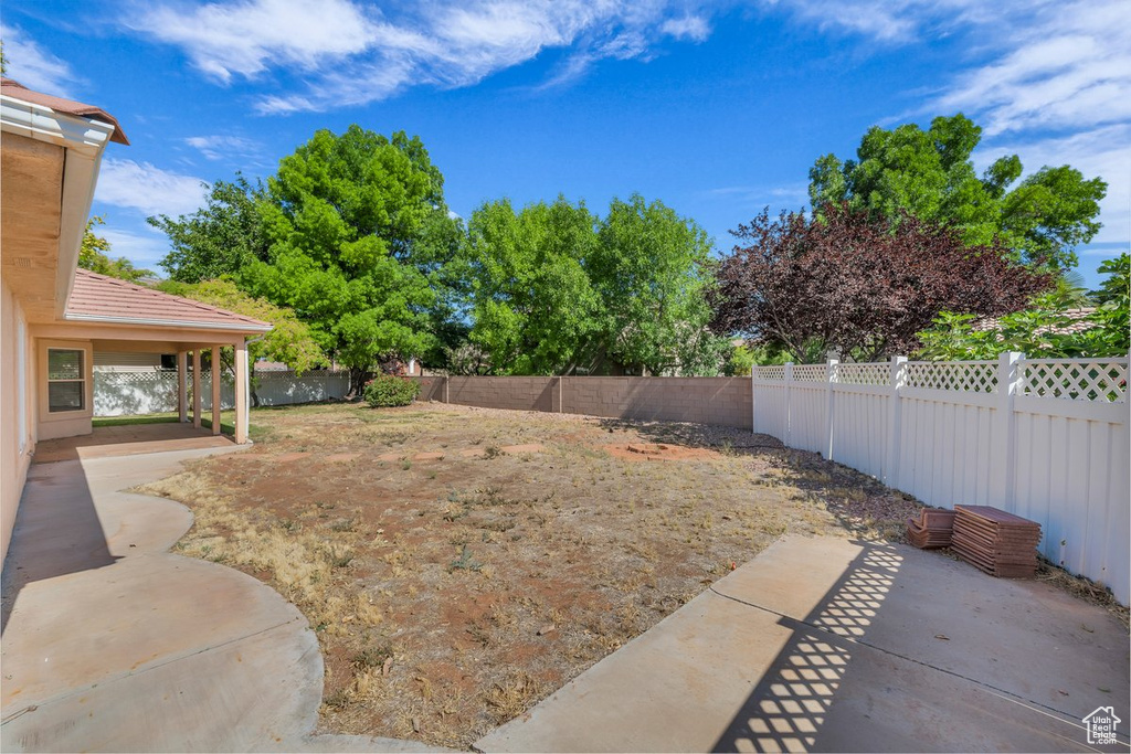 Fenced backyard featuring a patio area