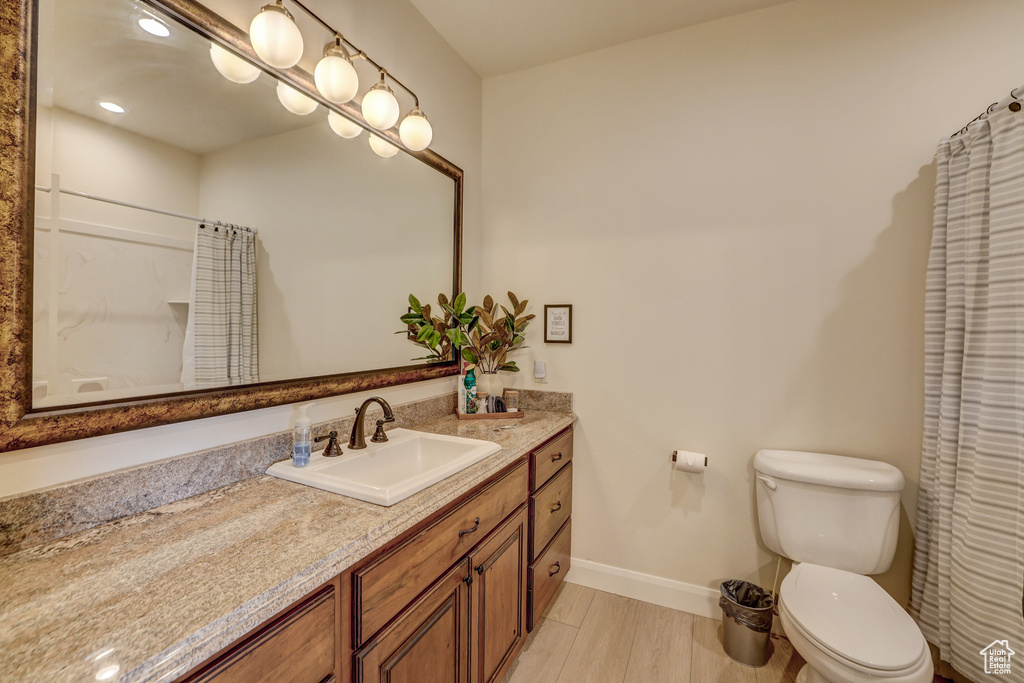Bathroom featuring vanity and curtained shower