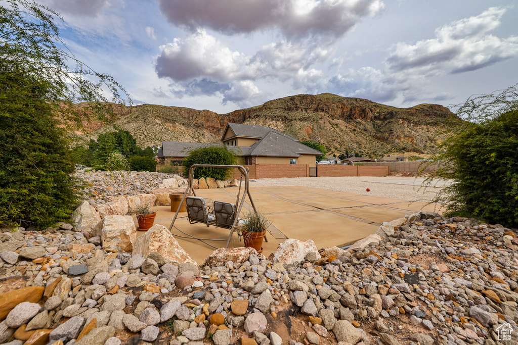 View of yard with a patio and a mountain view