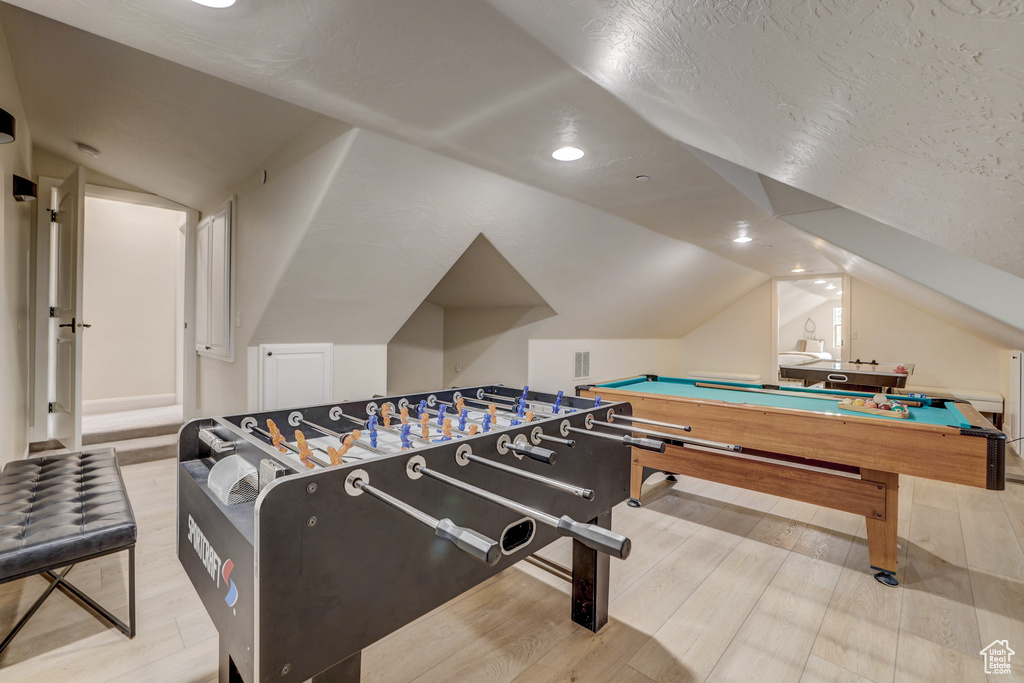 Playroom with lofted ceiling, wood finished floors, billiards table, and recessed lighting