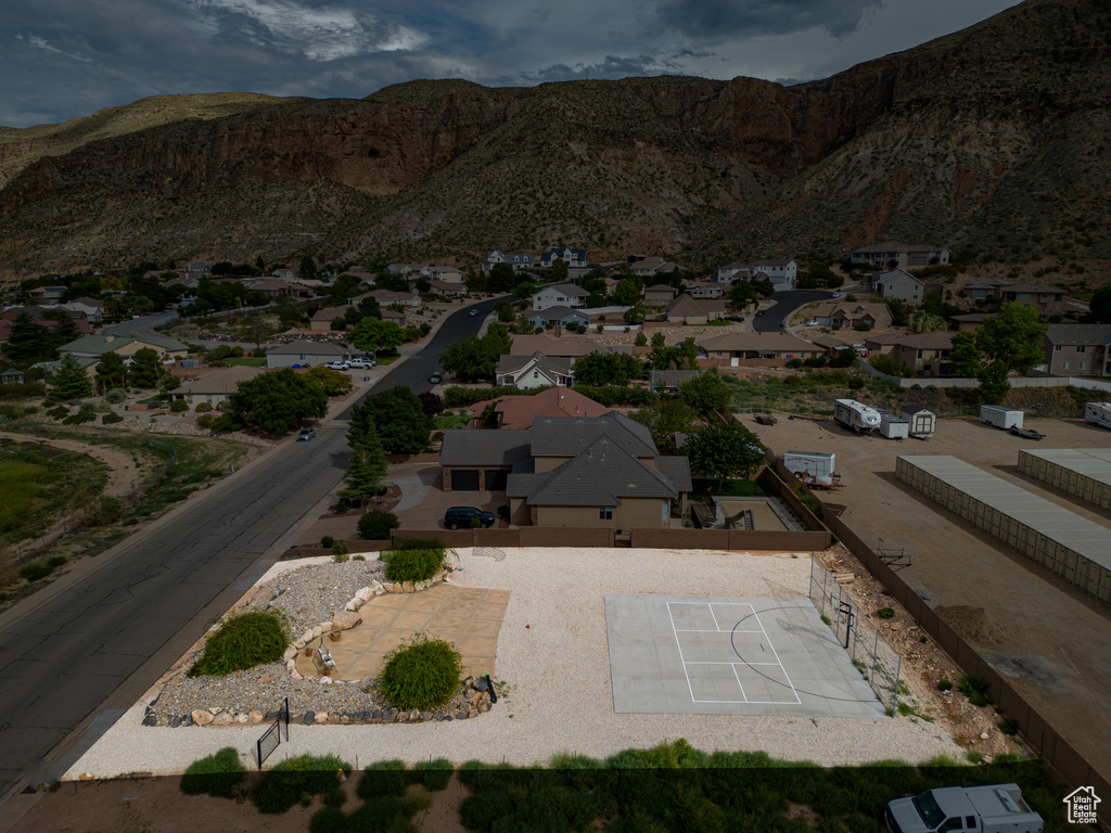View of mountain backdrop featuring nearby suburban area