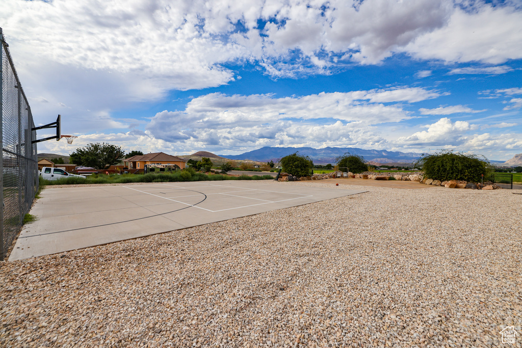 View of sport court with community basketball court and a mountain view