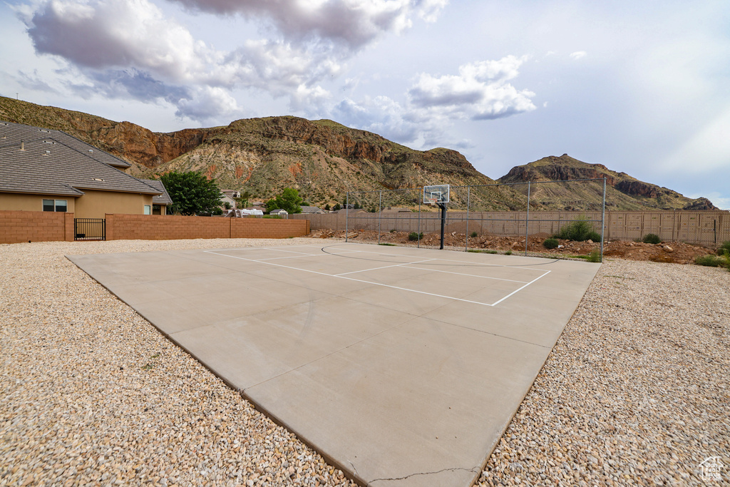 View of patio / terrace featuring a mountain view and community basketball court