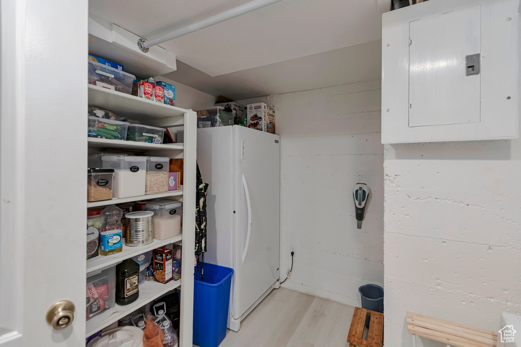 Storage area featuring electric panel
