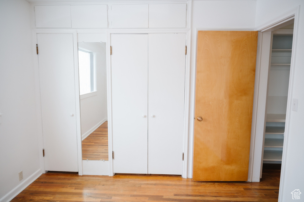 Unfurnished bedroom with light wood-style flooring
