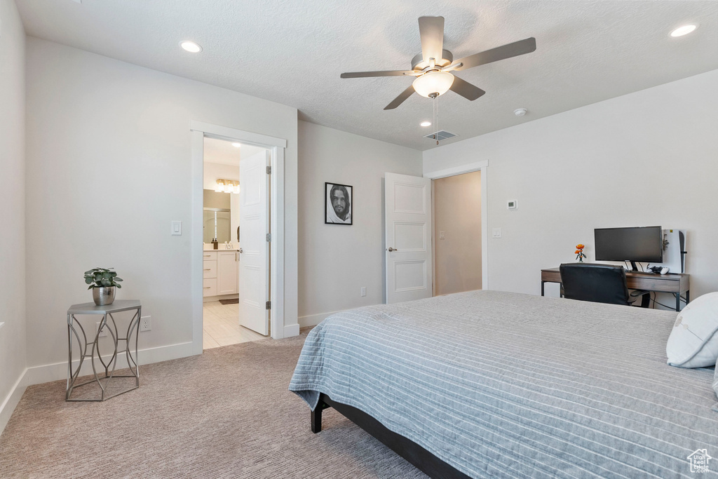 Bedroom with light carpet, recessed lighting, ceiling fan, and connected bathroom