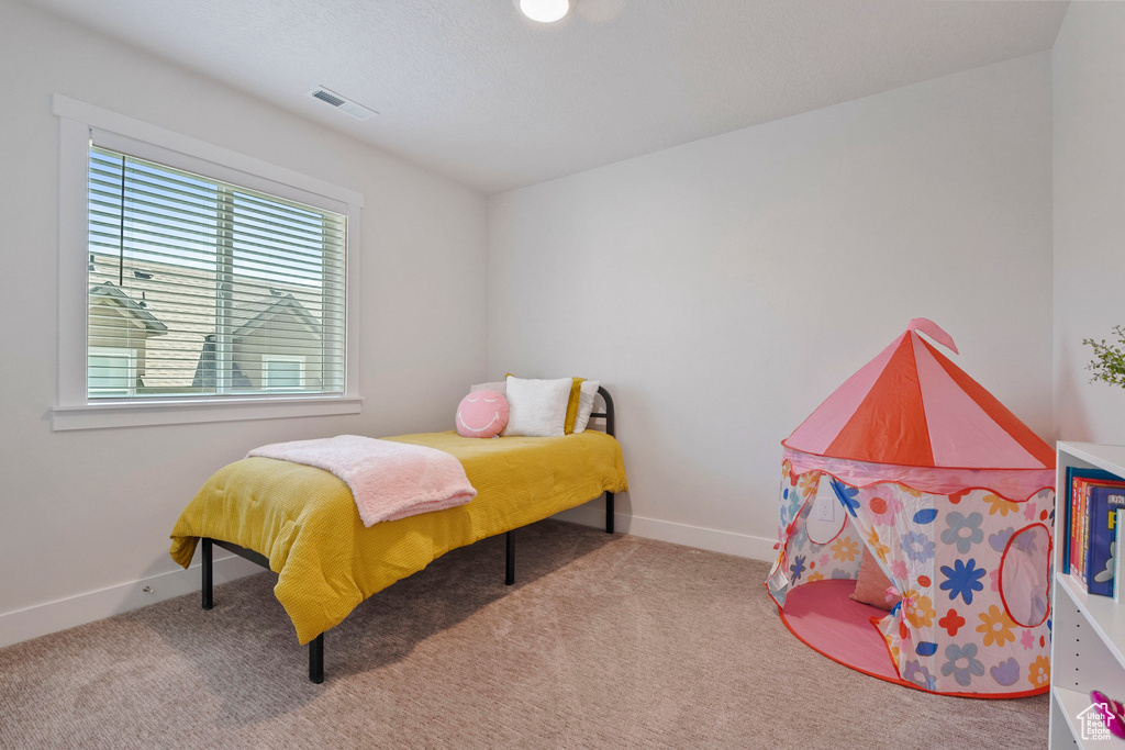 Bedroom featuring carpet