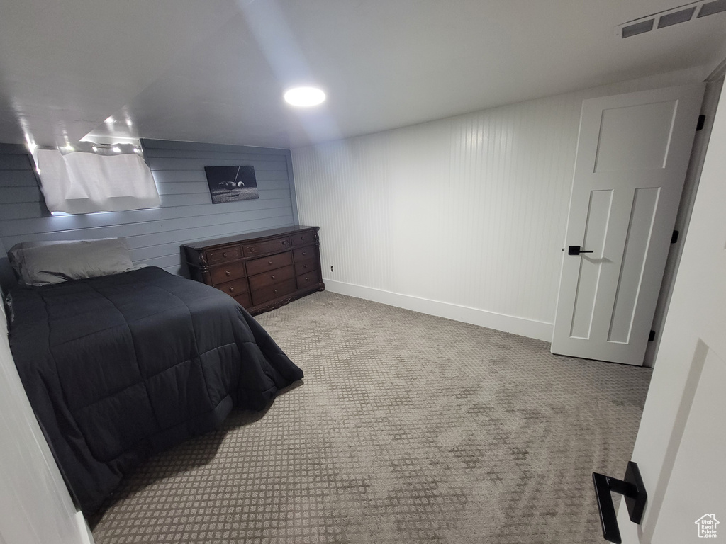 Carpeted bedroom with baseboards