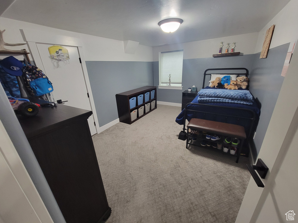 Carpeted bedroom with baseboards