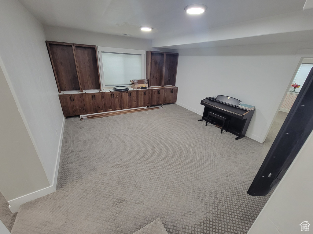 Finished below grade area with light colored carpet