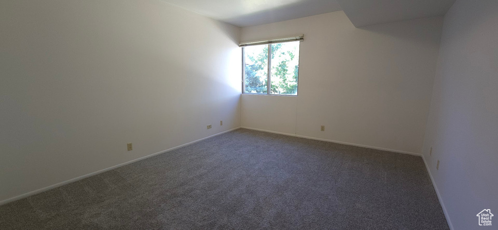 Spare room with carpet floors and baseboards