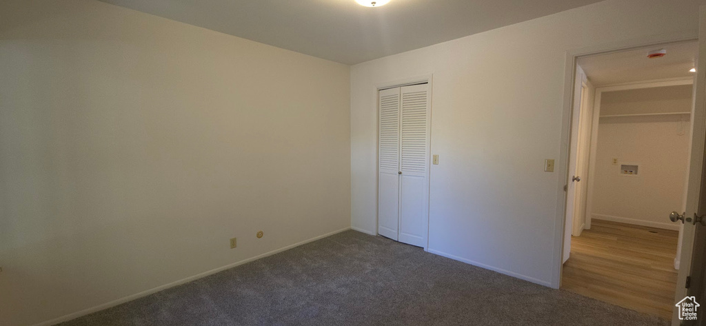 Unfurnished bedroom with carpet floors and a closet