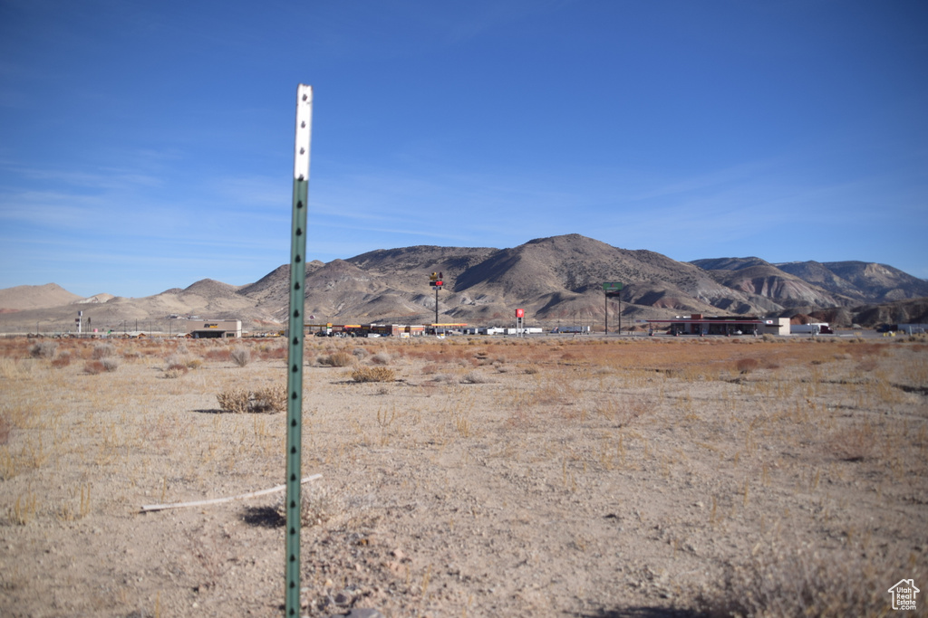 View of mountain backdrop featuring rural landscape