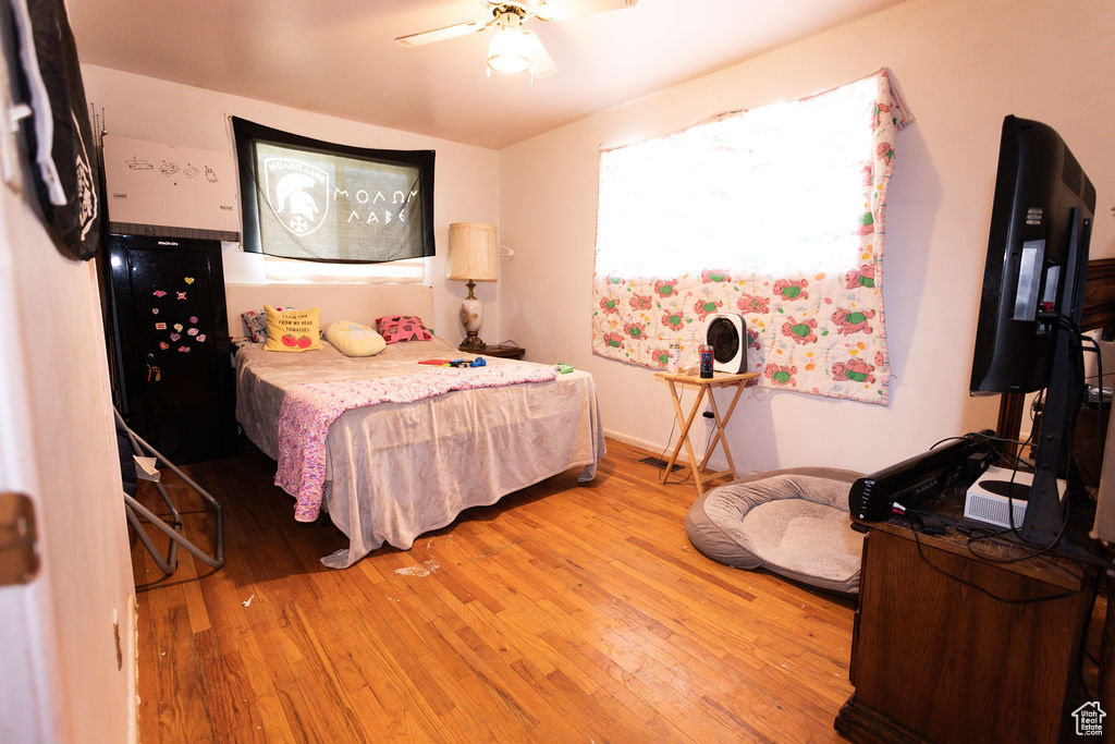 Bedroom featuring light wood-style floors and ceiling fan