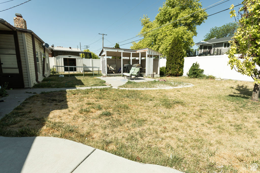 Fenced backyard with a patio area