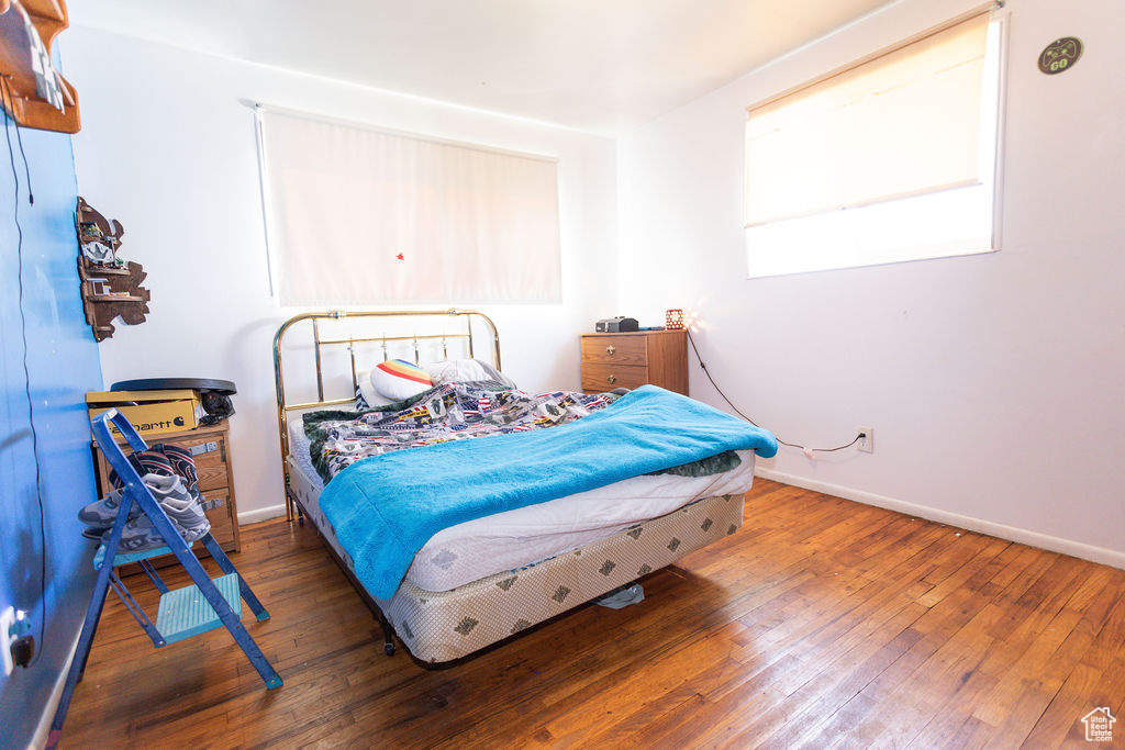 Bedroom with wood-type flooring
