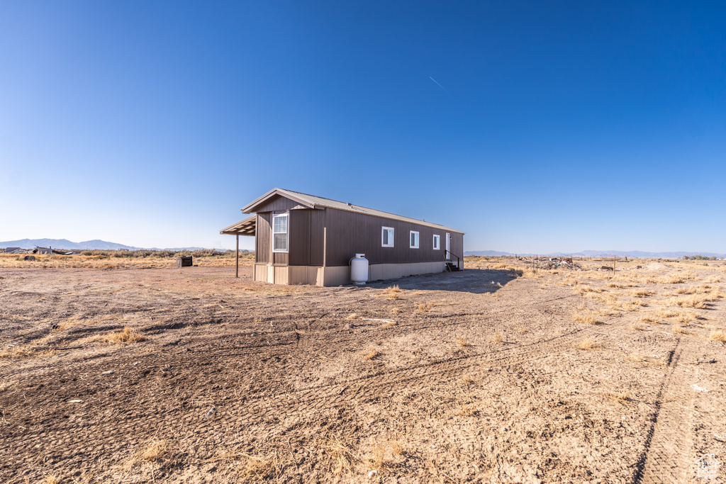 View of outbuilding with a mountain view
