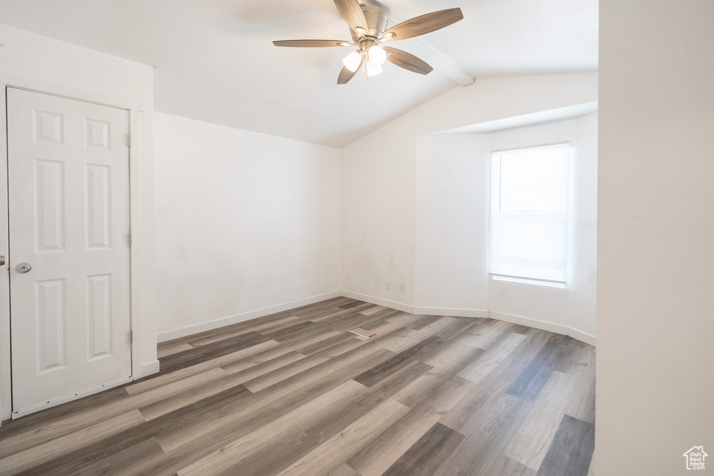 Empty room featuring ceiling fan and wood finished floors