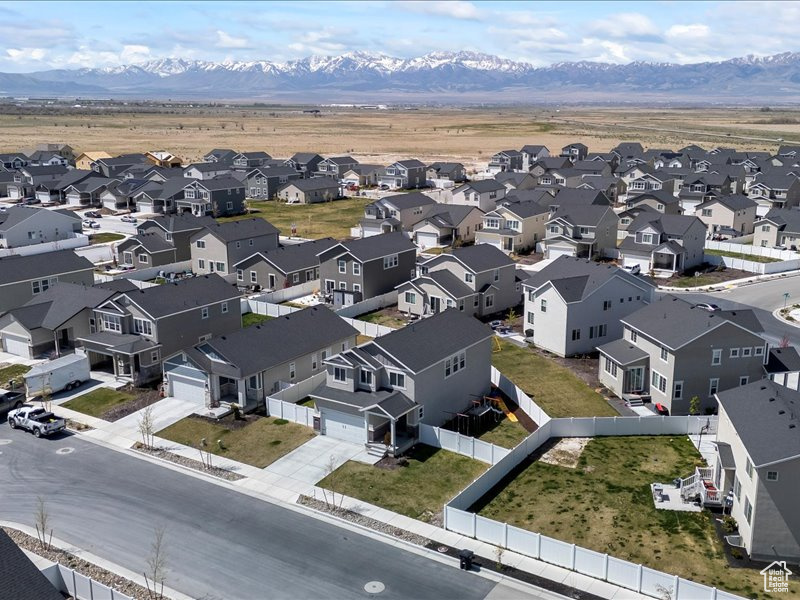 Aerial perspective of suburban area featuring mountains