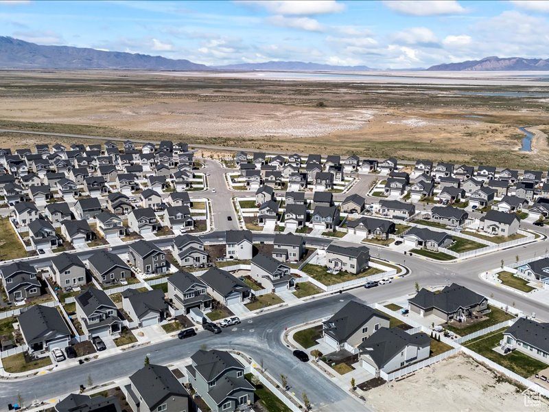 View of property location featuring a mountain backdrop and nearby suburban area