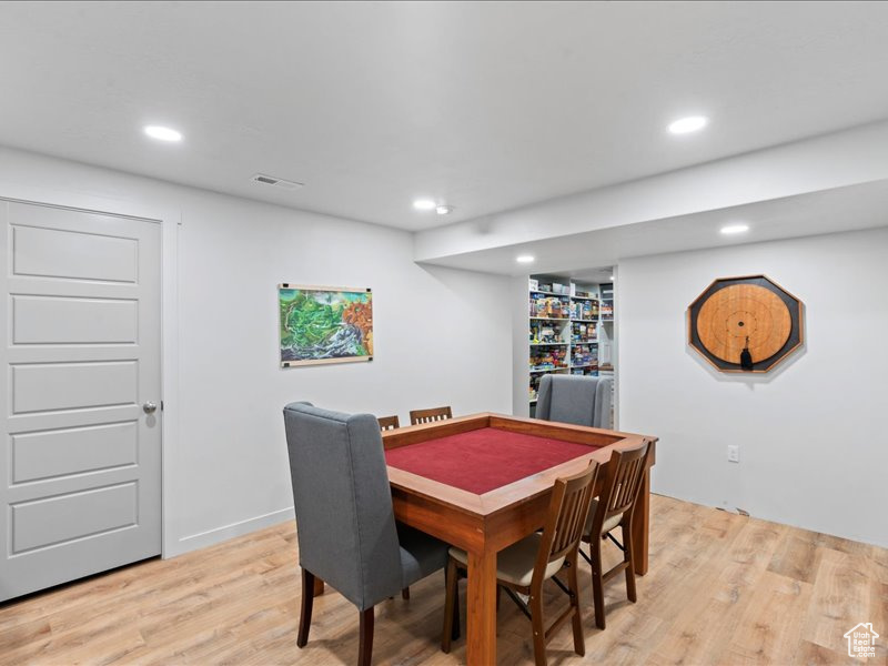 Dining room featuring light wood-style floors and recessed lighting