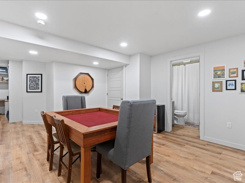 Dining area featuring light wood-style flooring and recessed lighting