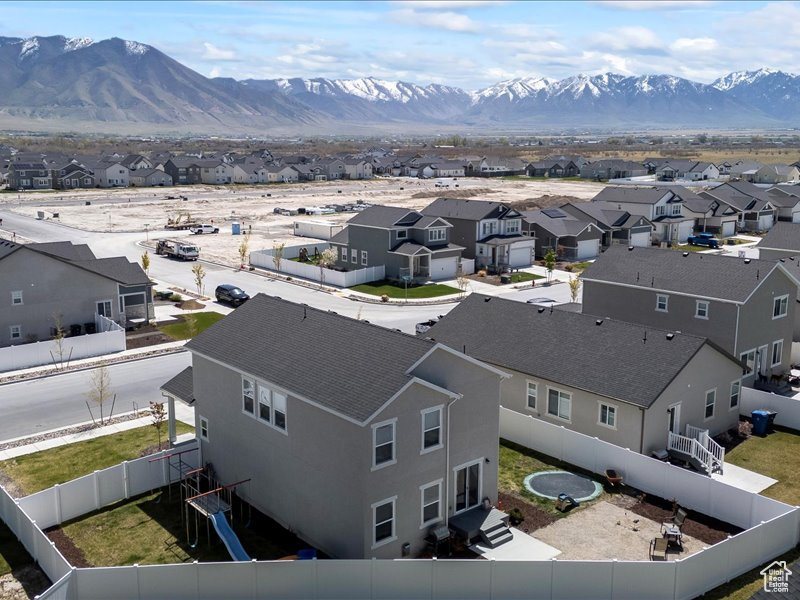 Aerial view of residential area with a mountainous background