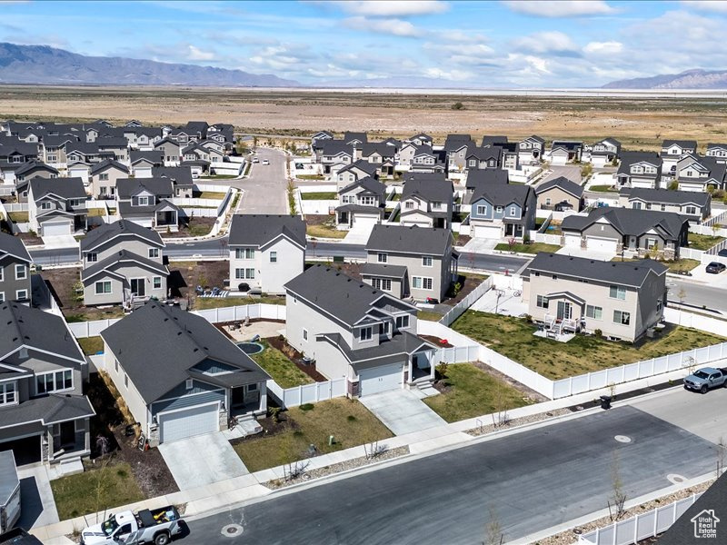 Aerial perspective of suburban area with a mountain backdrop