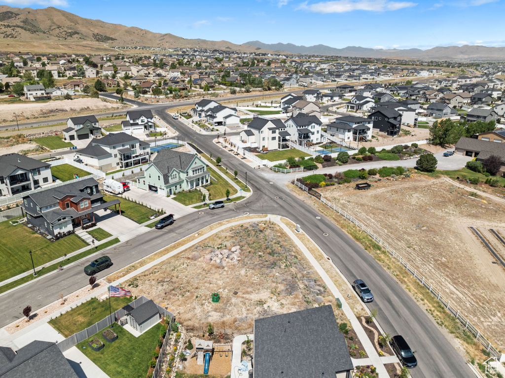 Aerial view of residential area featuring a mountainous background