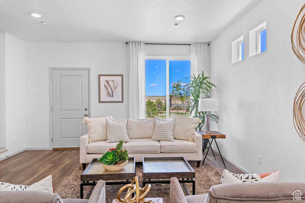 Living room featuring wood finished floors and baseboards