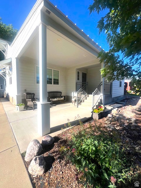 Rear view of house with a patio area