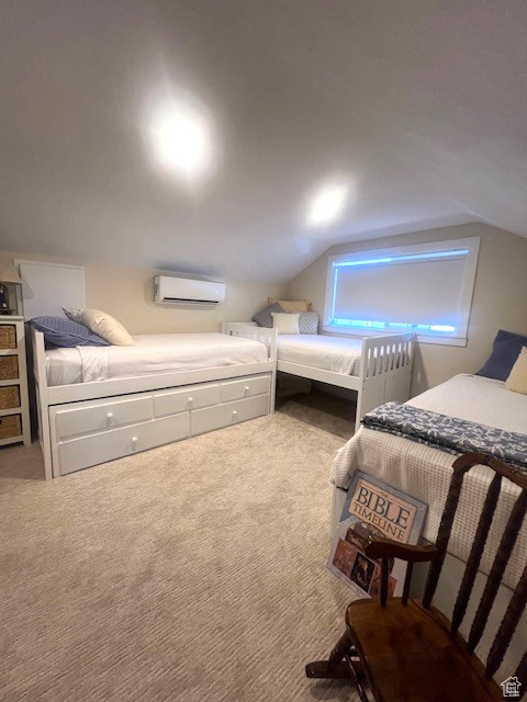 Carpeted bedroom with a wall mounted air conditioner and lofted ceiling